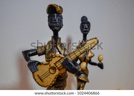 statuettes of Cuban women and men a souvenir of wood Royalty-Free Stock Photo #1024406866