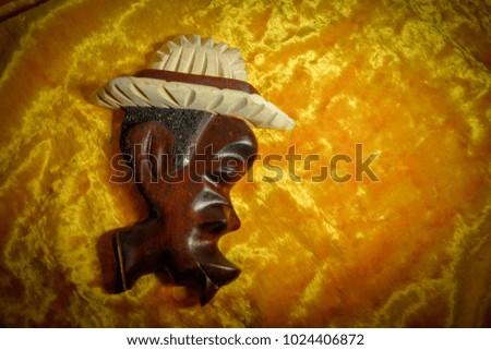 the head of a Cuban man a souvenir of wood Royalty-Free Stock Photo #1024406872
