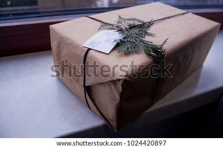 a box with a gift near the window