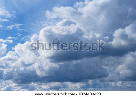 a beautiful blue sky with white clouds as background