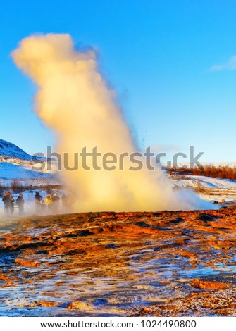 Eruption of Strokkur Geyser in winter, where is on the popular route of Golden Circle in southwest Iceland.