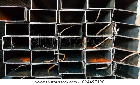 Construction steel profile pipe of rectangular shape at the warehouse of steel products.