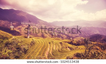 Cable car above the Longji Rice terraces (Dragons Backbone) in Longsheng County, color toned picture, China.