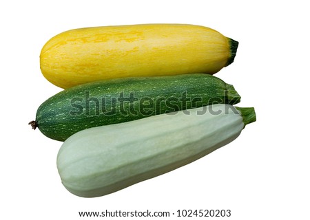 three isolated zucchini courgettes of different colors on white background, side view flat
