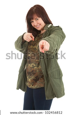smiling pointing you fat young woman in militry jacket, white background