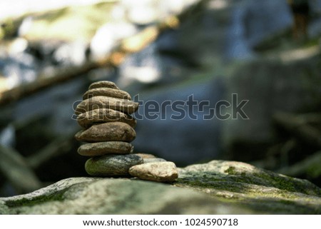 Rock cairn stacked in the forest light in North Carolina.