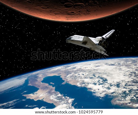 Mars and earth. Shuttle flies to the red planet. The elements of this image furnished by NASA.