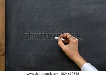 Hand writing on chalkboard / blackboard