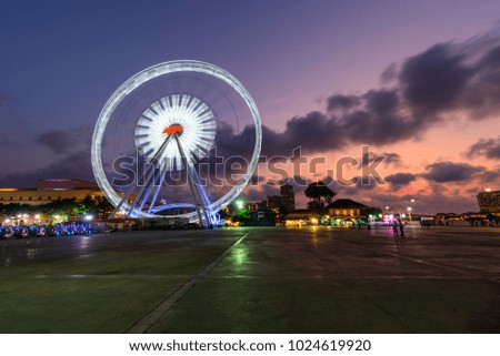 Ferris wheel in carnival park evening