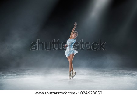 girl skating at ice arena
