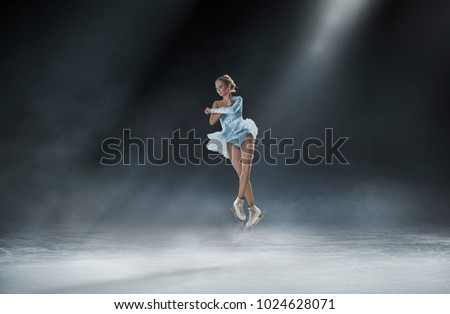 girl skating at ice arena