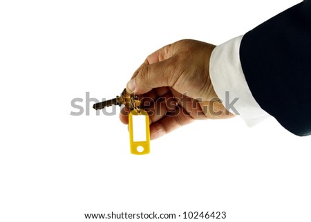 Hand whith key  with blank tag on white background. Isolated object