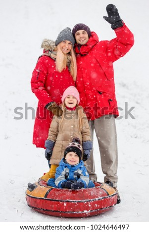 Photo of family walk with daughter and son on tubing