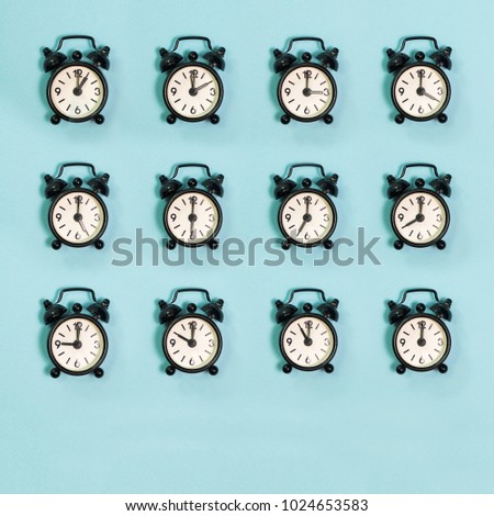 All time of black clock on blue background.