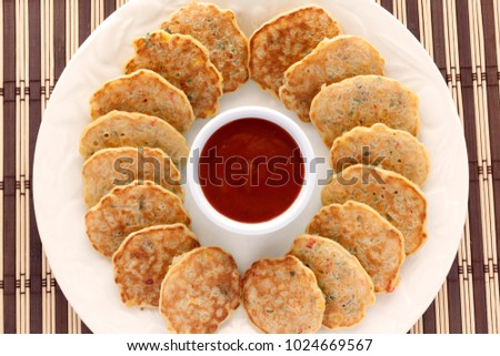 Vegetable pancakes with sauce. Top View. 