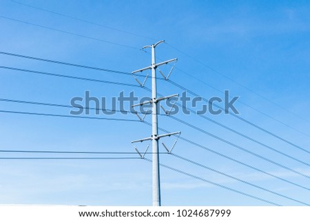 Electricity Transmission Line or Pylon, High voltage power to transfer the electricity from Power plant with the blue sky background.