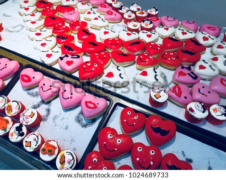 Close Up Of Assorted Donuts With Pink And Red Glazed And Sprinkles Donuts. Donuts On A Table On The Background. Happy Valentine's Day Concept.