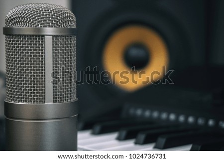 Professional studio monitor and condenser microphone. Concept of home music studio.