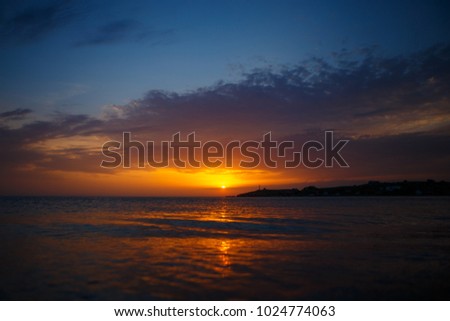 Beautiful blazing sunset landscape . Amazing summer sunrise as a background. scenic seascape by perfect timing when sunset over sea horizon is a beautiful pattern for background. sunset over the sea. 
