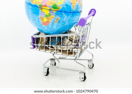 Shopping cart with coins for retail business. Image use for online and offline shopping, marketing place world wide, business concept.