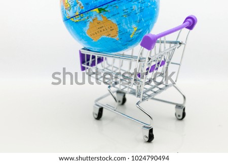 Shopping cart with world map for retail business. Image use for online and offline shopping, marketing place world wide, business concept.