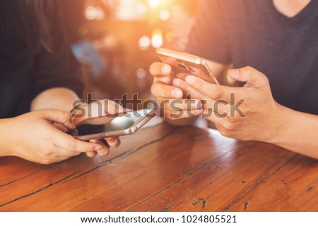 Man and woman using mobile phone connection, hands holding smartphone, technology lifestyle