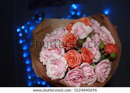 bouquet of delicate pink roses blue bokeh lights
