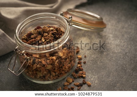 Delicious granola in a glass jar.