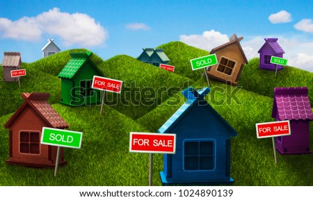 Sale of real estate: country colorful one-storey houses standing on the hills.