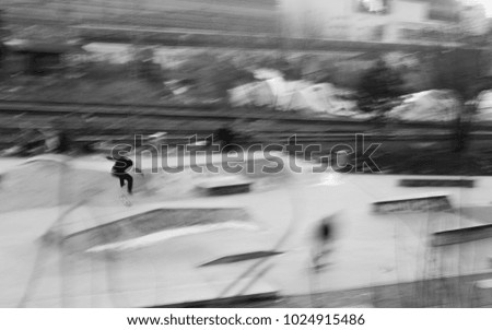 blurry skater in motion at the skatepark
