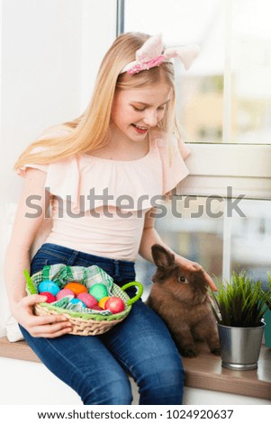 Teenage girl holding Easter eggs