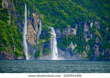 Beautiful waterfall, Milford Sounds, South Island - New Zealand.