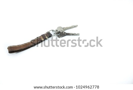 Dirty leather keychain used on white background