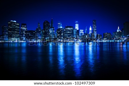 Lower Manhattan in New York in a blue hue at nighttime