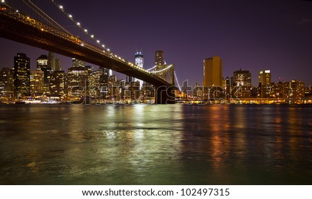 Lower Manhattan and Brooklyn Bridge in New York at nighttime