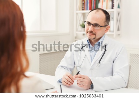 Happy doctor consulting woman, healthcare and medical concept, copy space