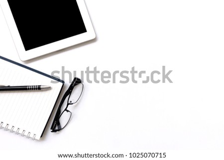 White office desk table with blank notebook, blank screen tablet, Top view, flat lay.