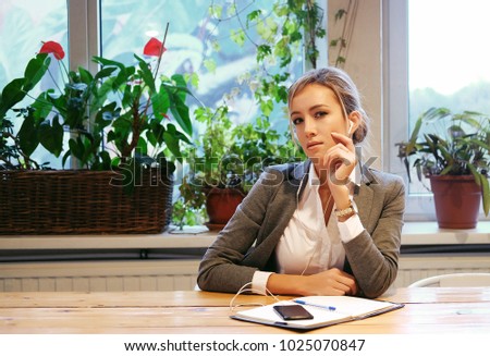 business  and people concept: Modern business woman in city cafe