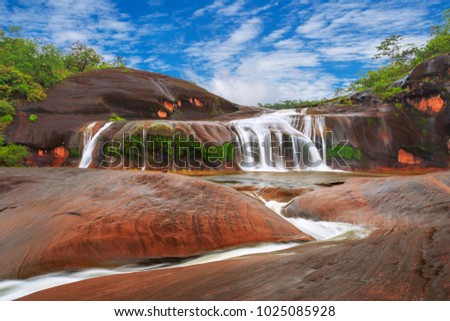 Tham Phra waterfall with blue sky in rain forest at  Bueng Kan Province,Thailand
 Royalty-Free Stock Photo #1025085928
