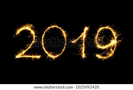 New Year 2019 text handmade written sparkles fireworks. Beautiful Shiny Golden numbers isolated on black background for design Royalty-Free Stock Photo #1025092420