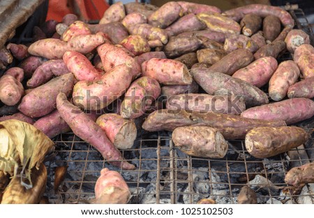 Sweet potato roasted on roaster in walking street market.