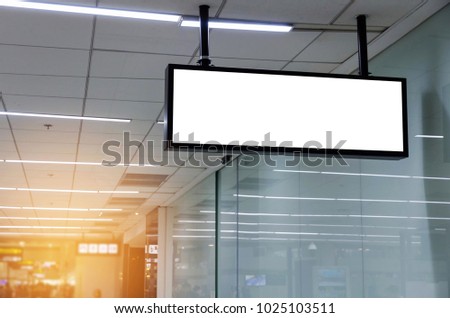 hanging blank advertising billboard or light box showcase on wall at airport or subway train station, copy space for your text message or media content, advertisement, commercial and marketing concept