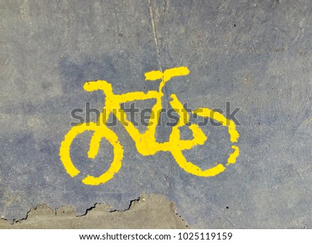 Yellow bicycle icon on floor