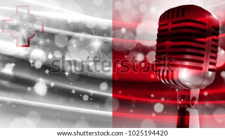 Microphone on a background of a blurry flag malta close-up