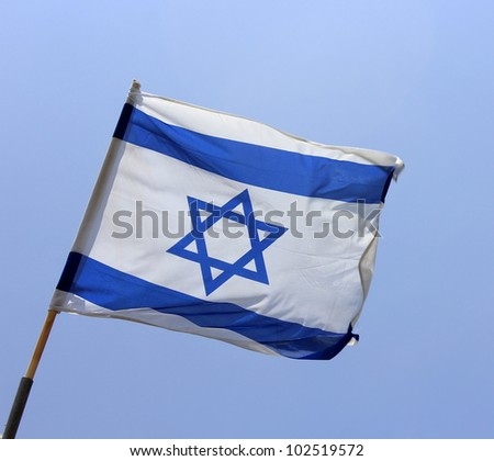 Israel's national flag on blue sky background