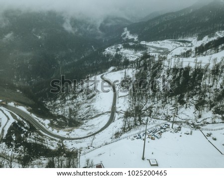 aerial view of the road on a winter snowy day	