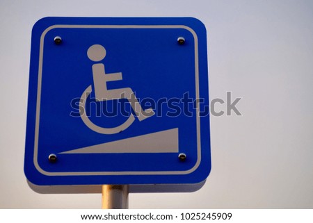 Signs slope disabled people.Over exposed