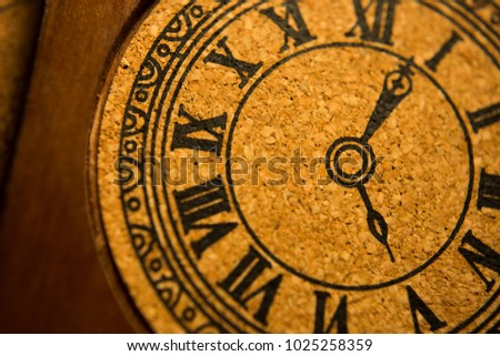 Closeup wooden clock decoration with roman numerals 