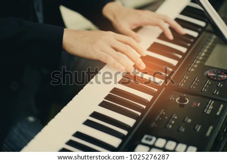 play piano, play keyboard closeup hand