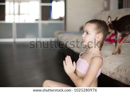 little caucasian girl engaged in aerobics